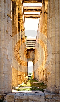 Temple of Hephaestus in Ancient Agora in sunlight, detail, Athens, Greece. It is old famous landmark of Athens. Perspective sunny