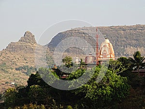 Temple on a hill top in nashik, Maharashtra with Plateaus in background