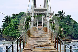 Temple on the island and old bridge. Sri Lanka, Matara