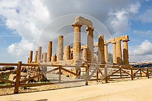 Temple of Juno Tempio di Giunone in Valley of the Temples Valle dei Templi near Agrigento, Sicily behind the wooden fence photo