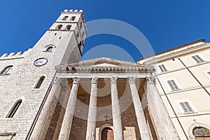 Temple of Minerva and Torre del Popolo in the historic center of Assisi, Perugia, Italy