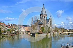 Temple Neuf meaning in French `New Temple` is a protestant church in Metz, France. It is surrounded by Moselle river