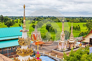 Temple of Phrathat Ruang Rong under the cloudy sky in Thailand photo