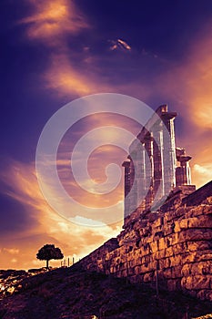 The Temple of Poseidon and a tree. Cape Sounion, Greece. Soft focus