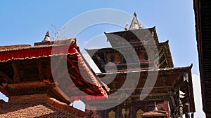 Temple roofs with wooden ornaments (Newari art) at Kathmandu Durbar Square in Nepal.