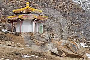 A temple of small monastery lost at the end of a rocky valley