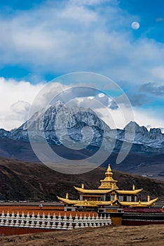 The temple, the snow mountain, and the moon