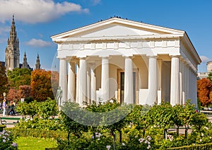 Temple of Theseus in Volksgarten park with City Hall at background, Vienna, Austria