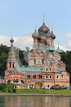 Temple of Trinity in Ostankino near pond at summer day