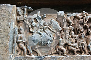 Hoysaleshwara Temple wall carving of Ishana god of northeast direction and water element marching on his bull