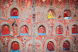 The Temple wall contains hundreds of Buddha statue`s in alcove`s the wal