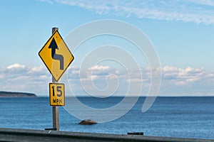 Tempo limit street sign, against the horizon and blue sky on a sunny day