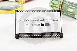Tempora mutantur et nos mutamur in illis Translated from Latin, it means Times are changing, and we are changing with them. on a photo
