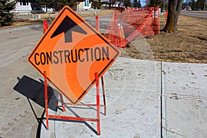 Temporary construction ahead sign on a sidewalk
