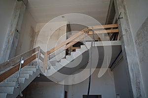 Temporary stair railing is built on a construction site