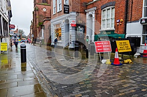 Temporary traffic signage beside rising ant terror bollards