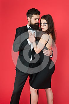 Temptation. sexy couple in love. formanl couple in tuxedo and black dress. elegant fashion and beauty. romantic date