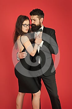 Temptation. sexy couple in love. formanl couple in tuxedo and black dress. elegant fashion and beauty. romantic date