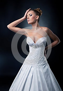 Tempting bride blonde fashion model posing