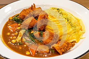 A tempting and delicious Japanese curry fried chicken omelet rice