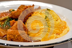A tempting and delicious Japanese curry fried chicken omelet rice