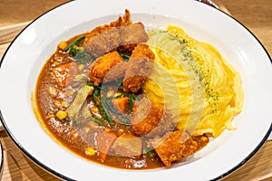 A tempting and delicious Japanese curry fried chicken omelet rice