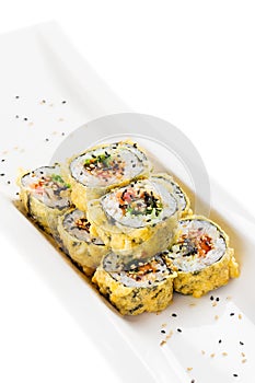 Tempura maki sushi - deep fried hot sushi roll with salmon, tuna