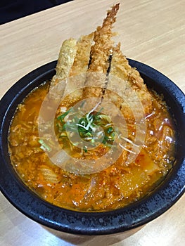 The tempura prawns in a soup