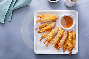 Tempura shrimp on a plate served with sweet and sour sauce