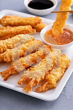 Tempura shrimp on a plate served with sweet and sour sauce