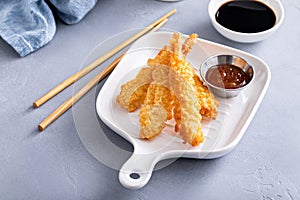 Tempura shrimp on a plate served with sweet and sour sauce