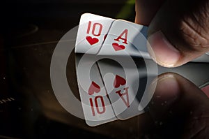 A ten and an ACE of spade in the hands