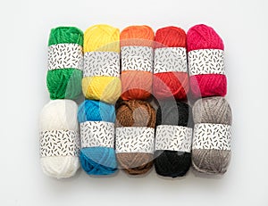 Ten assorted colors of wool yarn in balls