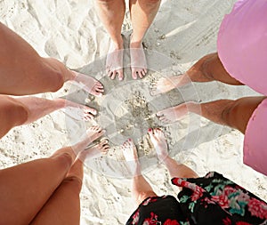 ten barefoot family of 5 on the sandy beach