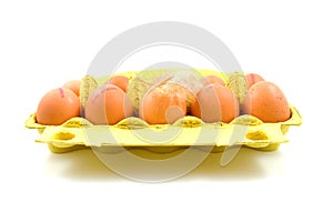 Ten chicken eggs in yellow box