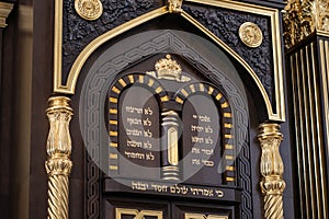 Ten commandments in Hebrew and David Star carved on wood in synagogue, close up