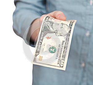 Ten dollars banknote in hand