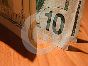 Ten dollars bill ($100 in shade) photo