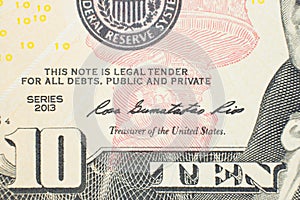 Ten dollars bill fragment of U.S. money in macro