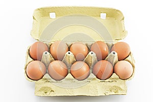Ten eggs in the carton isolated on white