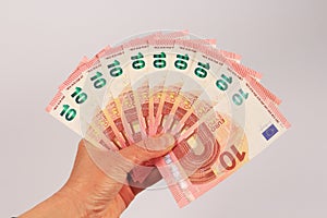Ten euro banknotes in hand photo