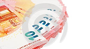 Ten euros notes on display on a white background