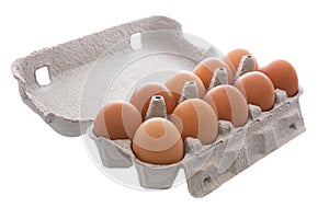 Ten fresh eggs in carton box .