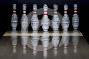 Ten pin bowling alley background. Closeup of tenpin row on a lan