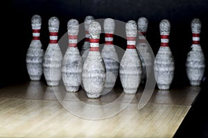 Ten pin bowling alley background. Closeup of tenpin row on a lan