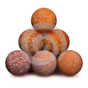 Ten rusty iron cannon balls on white background