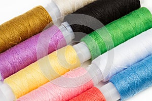 Ten spools of colored threads