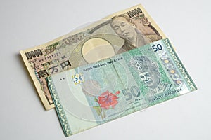 Ten thousand Japanese yen and fifty malaysia ringgit bank note