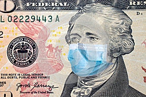 Ten US dollars bill with face mask. Coronavirus covid outbreak concept