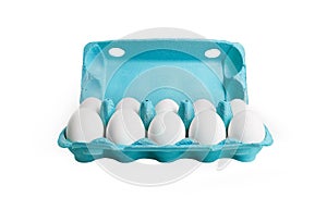 Ten white eggs in a carton box.